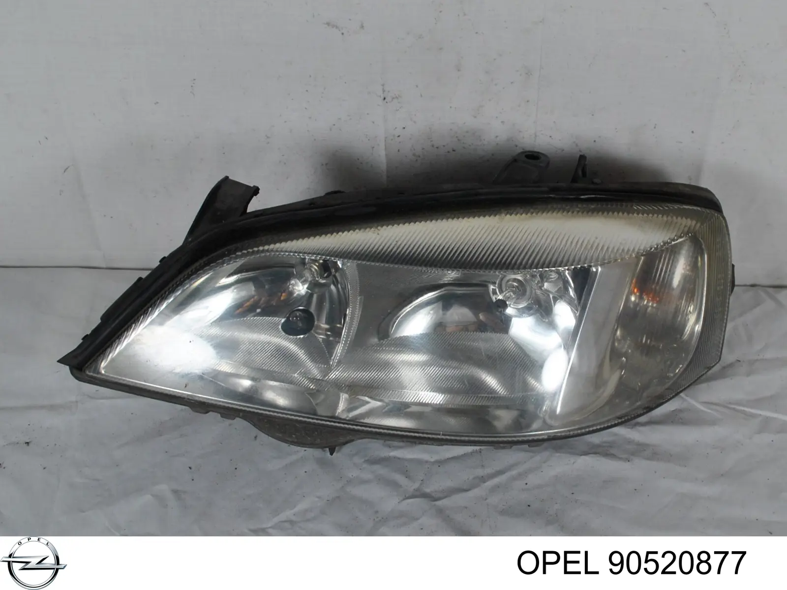 90520877 Opel faro izquierdo