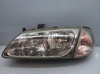 Faros delantero izquierdo 89003331 NISSAN